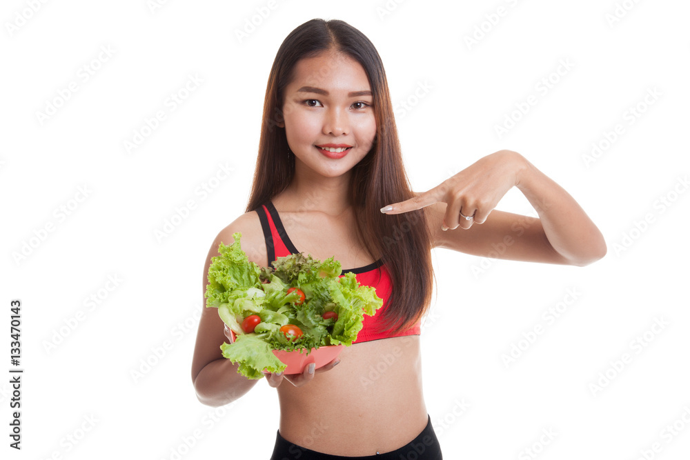 Beautiful Asian healthy girl point to salad. Beautiful Asian healthy girl point to salad.