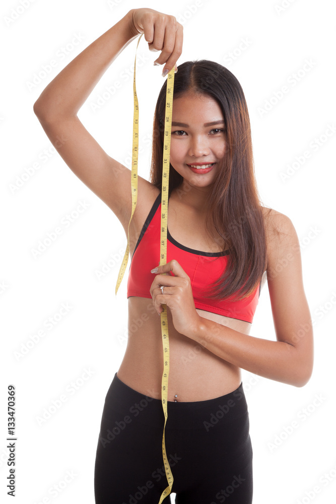 Beautiful Asian healthy girl with measuring tape. Beautiful Asian healthy girl with measuring tape.