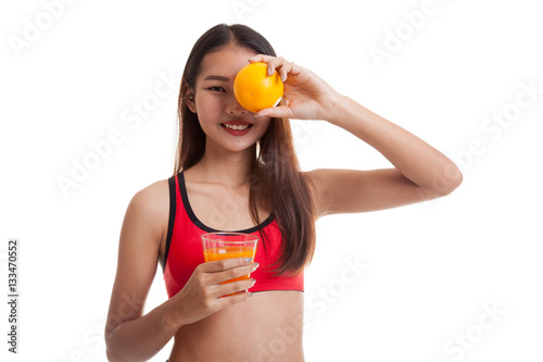 Beautiful Asian healthy girl with orange juice and orange fruit.