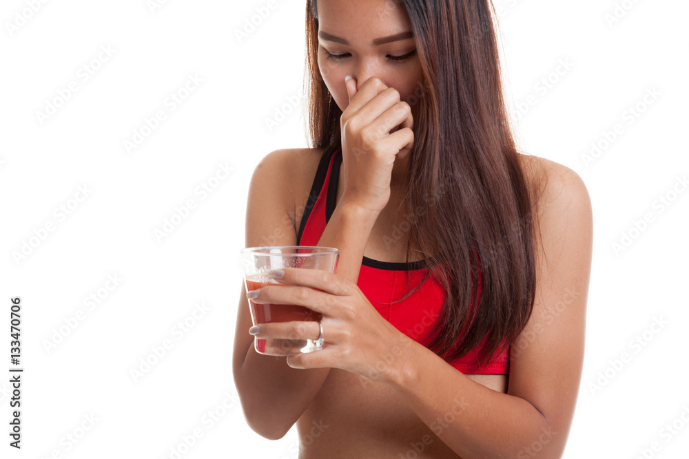 Beautiful healthy Asian girl hate tomato juice. Beautiful healthy Asian girl hate tomato juice.