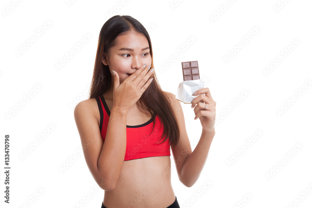 Beautiful healthy Asian girl very happy with chocolate. Beautiful healthy Asian girl very happy with chocolate.