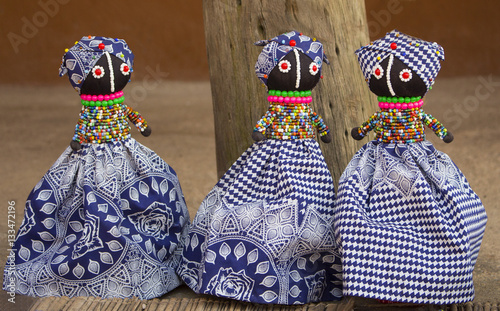 African rag dolls. Colorful beads, fabrics clothes. Local market.