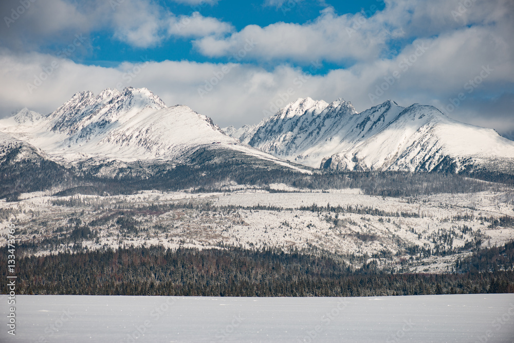 Winter landscape, snow covered mountain range. View of High Tatras, Slovakia Winter landscape, snow covered mountain range. View of High Tatras, Slovakia