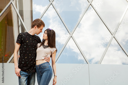 Gorgoeus cool looking couple looking at eatch other photo