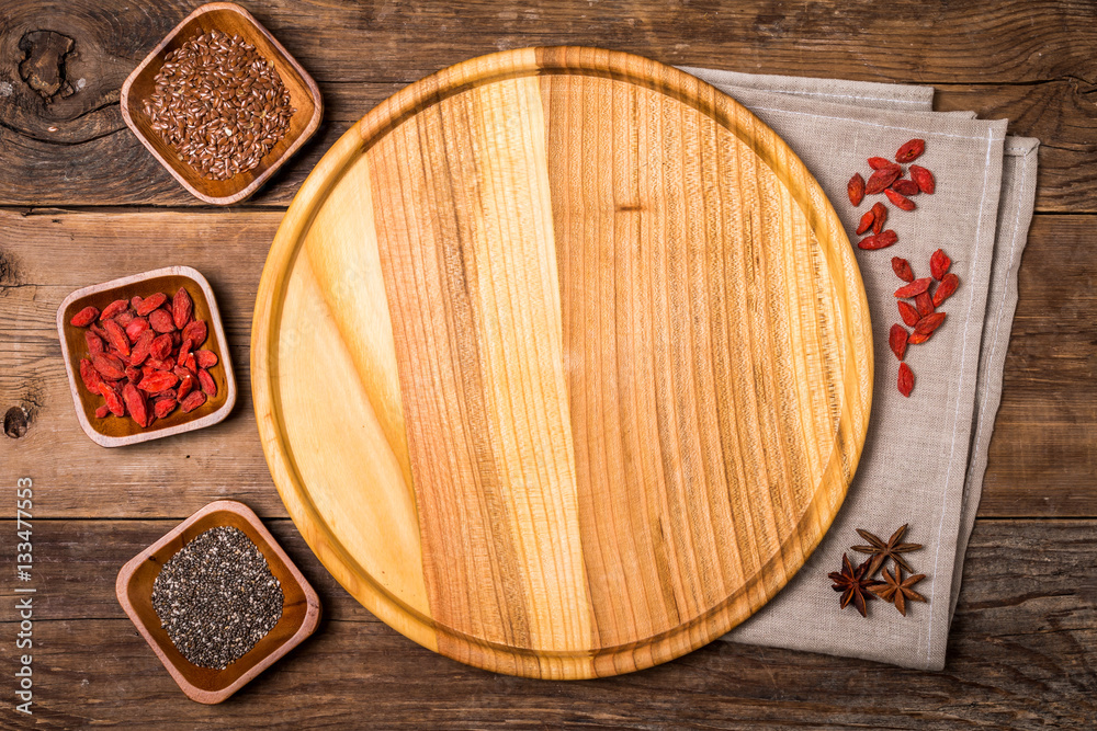Seeds and goji in a wooden bowls Seeds and goji in a wooden bowls