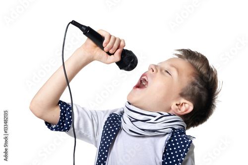 little boy sing song in microphone