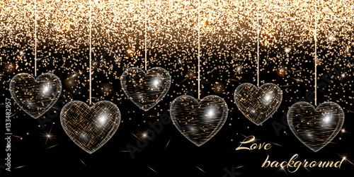 Valentine heart on a black background on a gold sparkling backdrop
