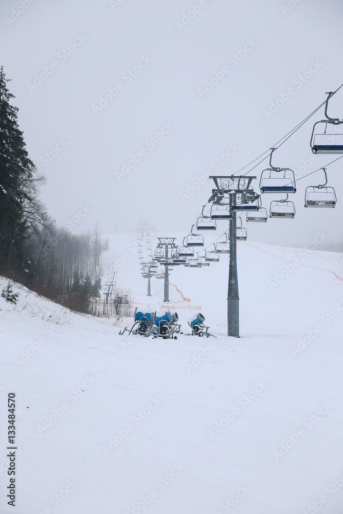 The elevator in ski resort in the winter in foggy weather The elevator in ski resort in the winter in foggy weather