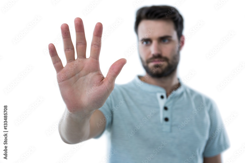 Man pretending to touch an invisible screen Man pretending to touch an invisible screen