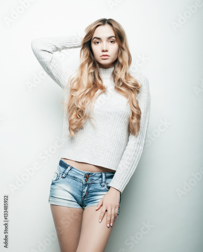 Young fashion model posing in studio