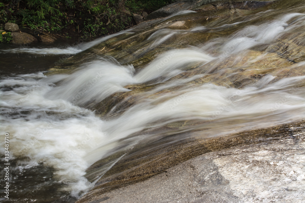 Nine dives waterfall falls from a cliff in the Central Valley Tenasserim mountain range located in Ratchaburi province Thailand. Nine dives waterfall falls from a cliff in the Central Valley Tenasserim mountain range located in Ratchaburi province Thailand.