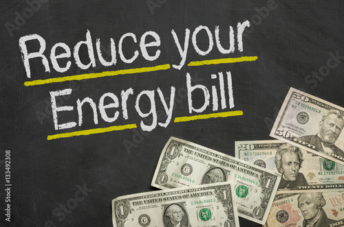 Text on blackboard with money - Reduce your energy bill