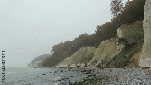 Rugen island chalk rock cliff landscape in autumn time. colorful beech tree forest. (Mecklenburg-Vorpommern, Germany). Baltic sea photo