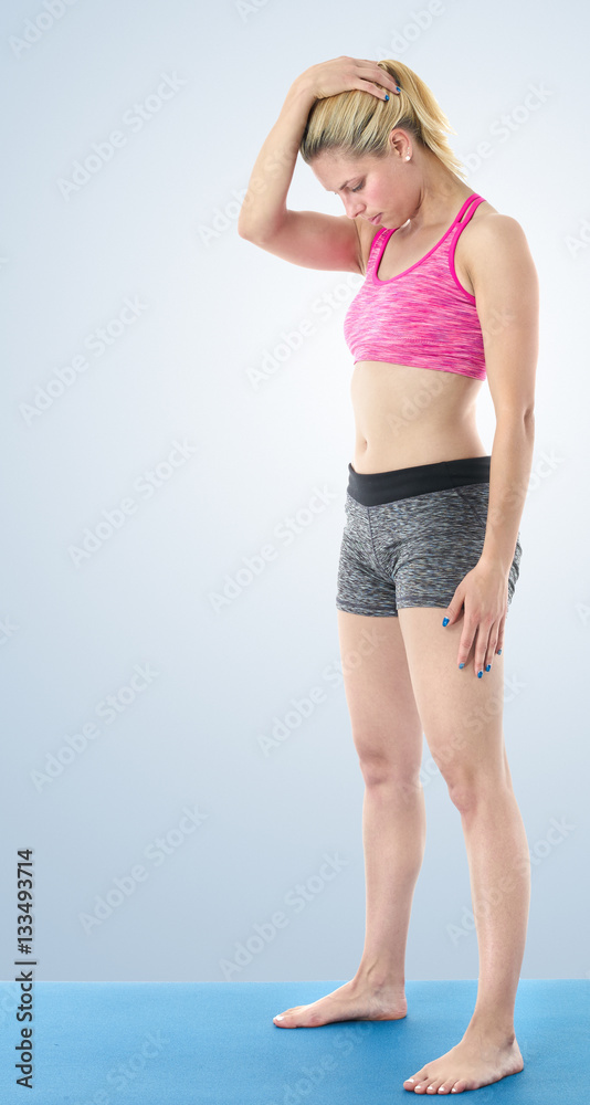 Woman making pilates mat exercises