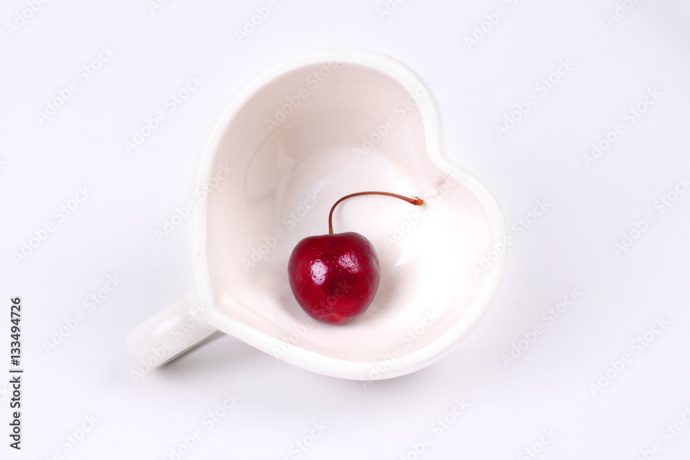 Cherry Chile and Heart-shaped mug on white. Cherry Chile and Heart-shaped mug on white.