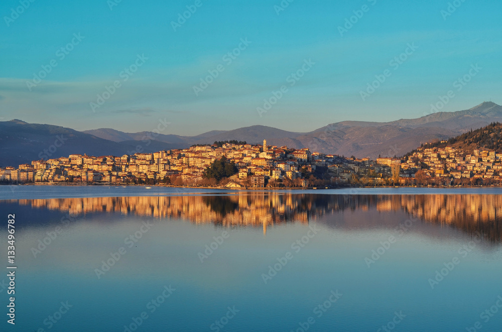 The picturesque city of Kastoria reflected on the lake of Orestiada.The lakeside city of north greece besides its rich history is wider known for the production and trade of furs and leather products