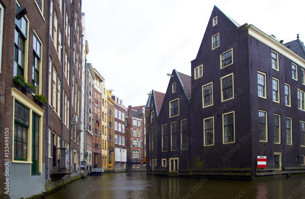 Naklejka premium rainy day one of canal in Amsterdam