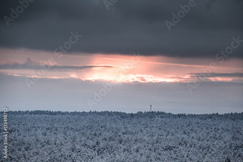 A beautiful winter landscape in nordic Europe in gray, overcast day - a view from watchtower
