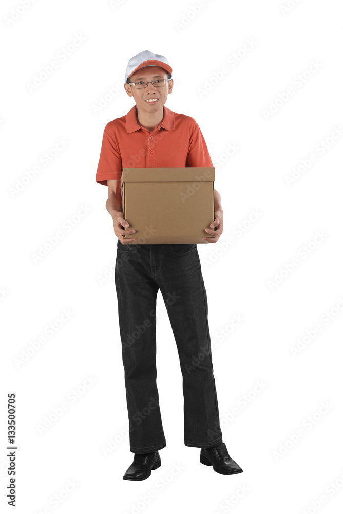 Young asian courier holding a cardboard box while standing Young asian courier holding a cardboard box while standing