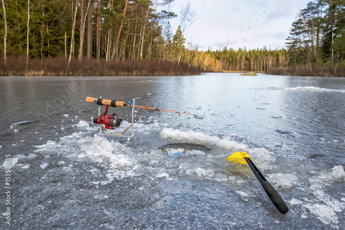 Ice fishing equipment on Swedish lake photo