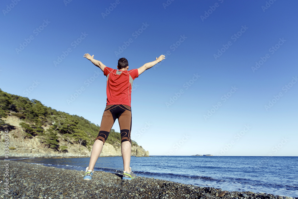 Running man in the summer in a beautiful location. Running man in the summer in a beautiful location.