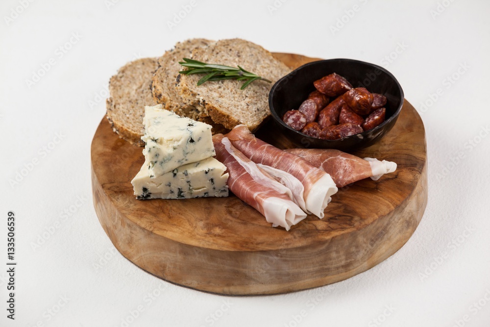 Bread slice, cheese and meat on wooden board Bread slice, cheese and meat on wooden board