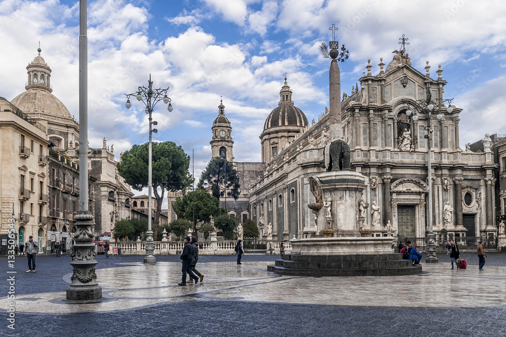 Piazza Duomo square in the hstoric center of Catania, Sicily, Italy, with a beautiful sky in the background