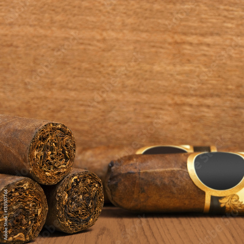 Cuban cigars on wooden background