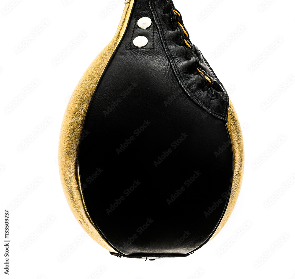 Gold and black leather boxing speed bag isloated on white.