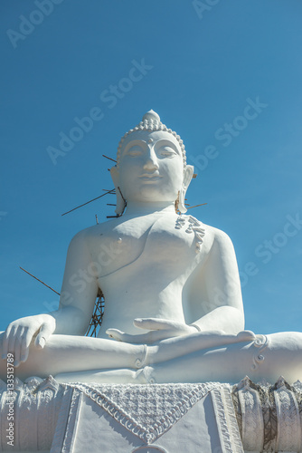 White buddha statue under construction at Phra That Maeyen templ photo