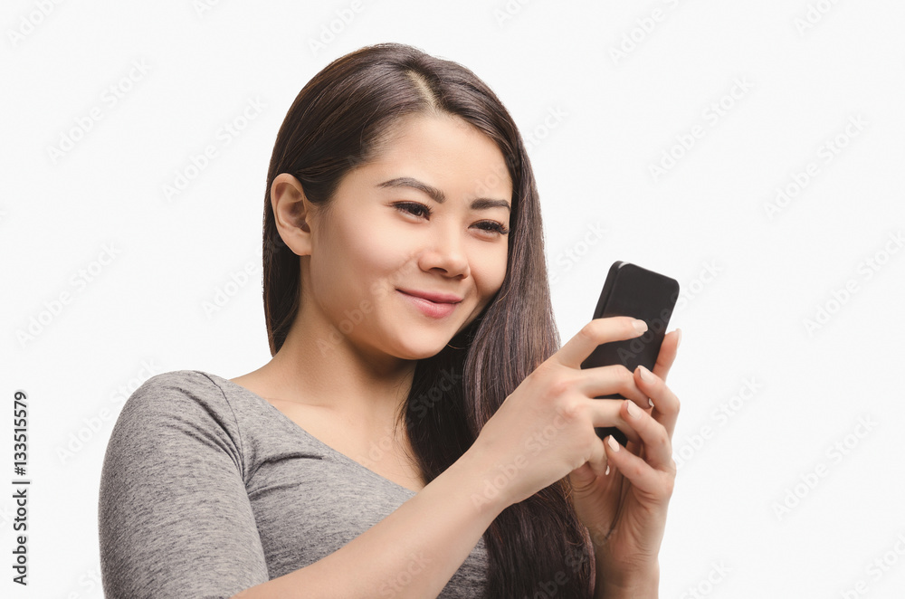Casual Asian girl with phone. Smiling. Casual Asian girl with phone. Smiling.