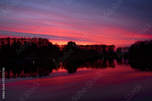 autumn sunset on a Belgian lake © Carlo
