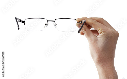 Woman hand holding eyeglasses
