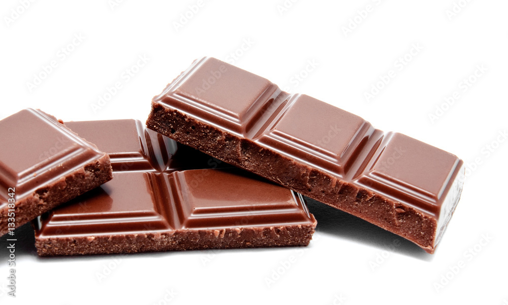 Dark milk chocolate bars stack isolated on a white Dark milk chocolate bars stack isolated on a white