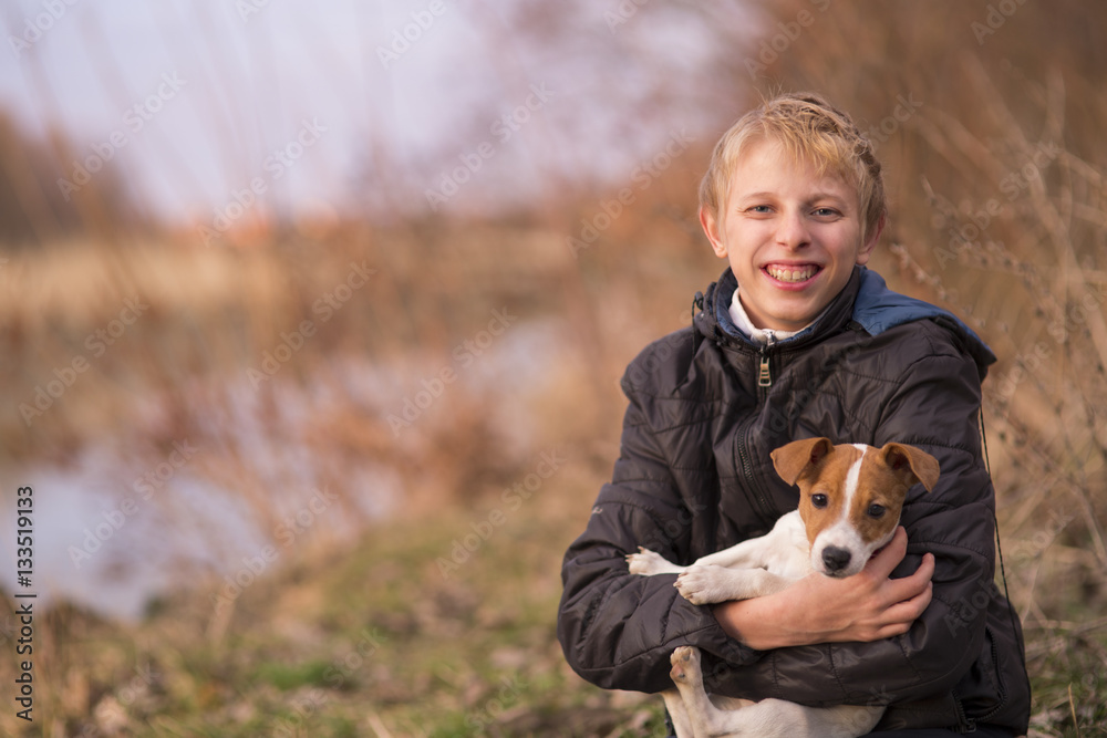 Boy hugging a Jack Russell puppy Boy hugging a Jack Russell puppy