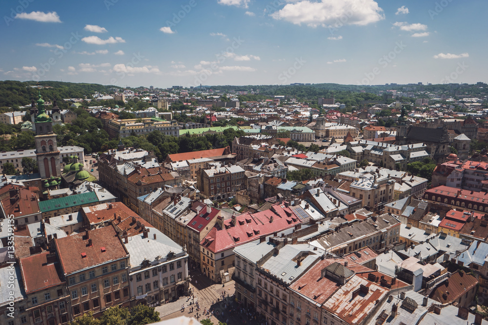 Town and cloudy sky. Aerial view of buildings. Old architecture and historic landmarks.