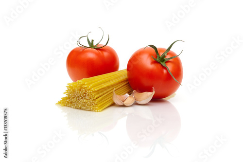pasta, tomatoes and garlic on a white background