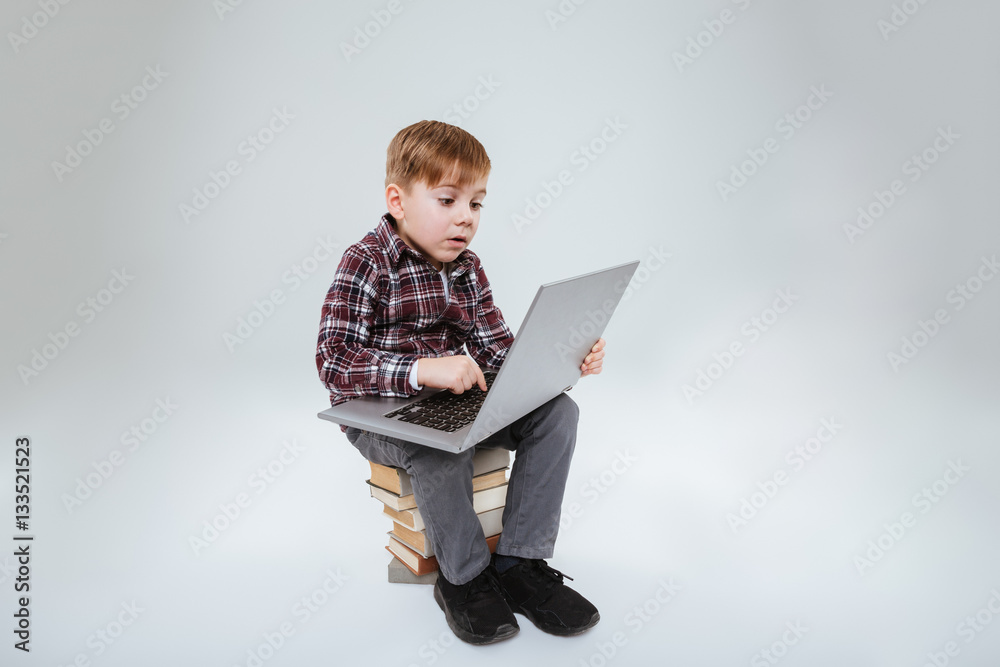 Young boy using laptop Young boy using laptop