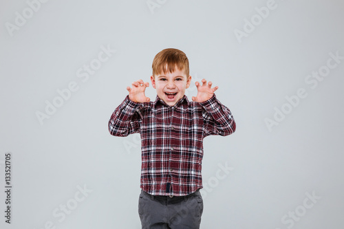 Funny young boy in studio