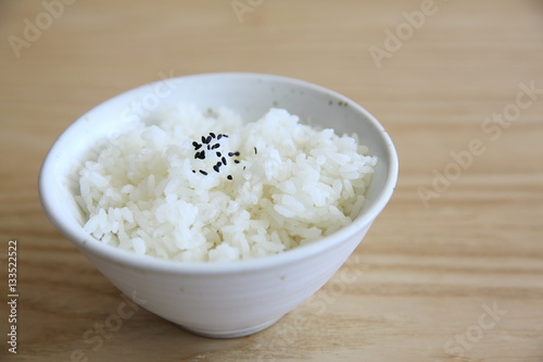 Rice on wood background