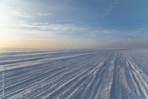 traces of the snowmobile on the frozen sea