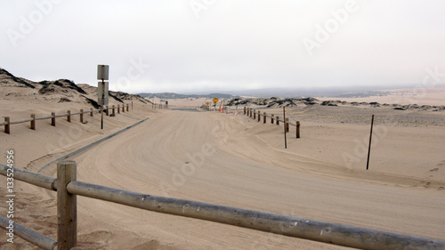 Guadalupe-Nipomo, CALIFORNIA, UNITED STATES - OCT 8, 2014: sand dunes and a street within the National Park in CA along Highway No 1, USA