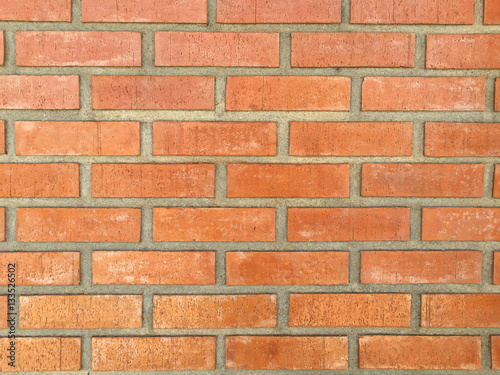 horizontal orange bricks wall hold by cement