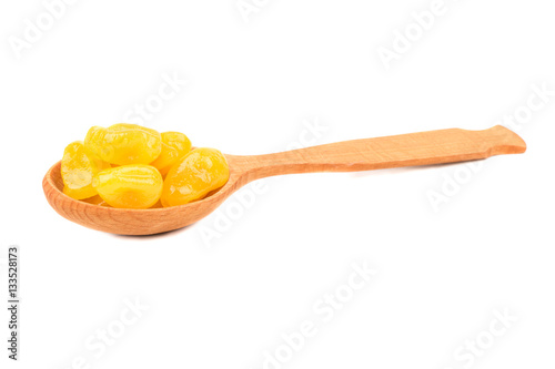 Dried yellow kumquat in spoon