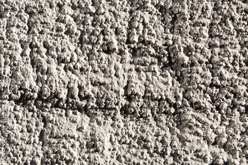 closeup of a pebbledashed wall