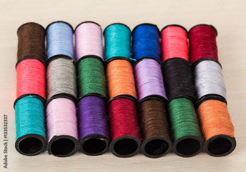 rows of threads of diffrent colors rows of threads of diffrent colors