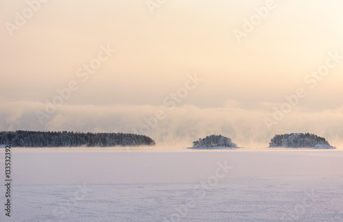 Blustery snow storm is coming from sea to frozen bay