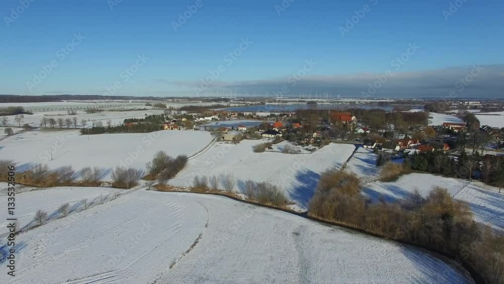 aerial view fly over snowy landscape with blue sky in germany - dronen flight aerial view fly over snowy landscape with blue sky in germany - dronen flight