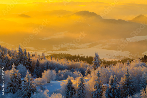 Mountain valley panorama during sunrise. Beautiful natural panoramic landscape in winter time.