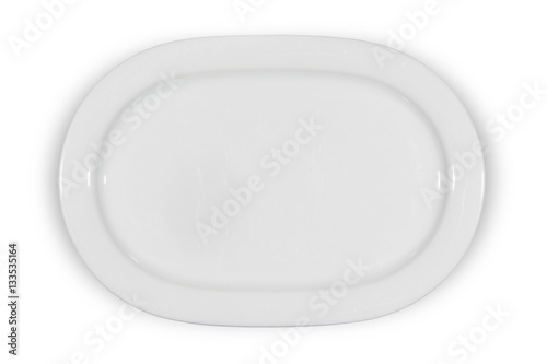 Flat white shallow porcelain oval plate with shoulders on white background directly from above